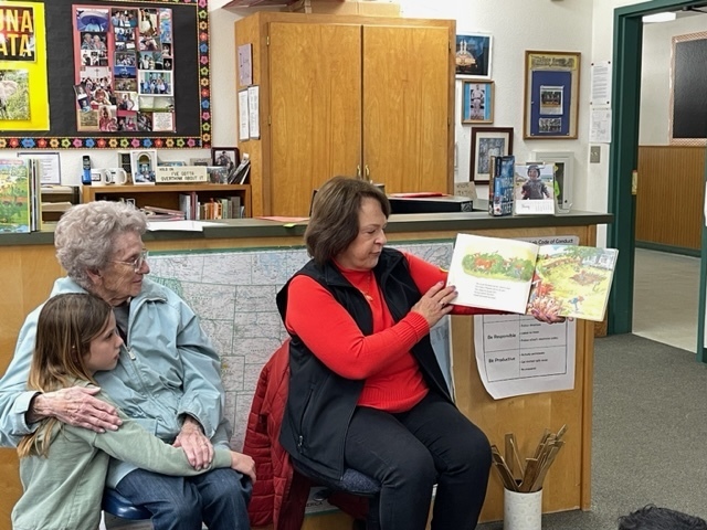 Grandparents reading to library class