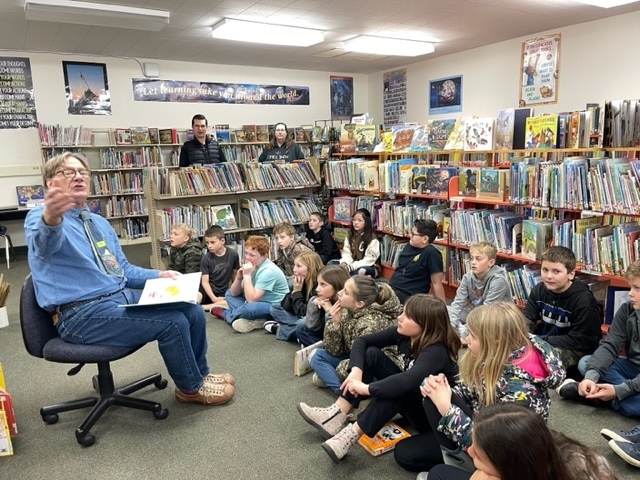 Grandparents reading to library class